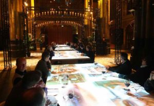 Managers sitting at interactive tables for business training