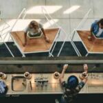 People using rolling table to keep distance at business event