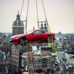 Lexus car hanging high above Amsterdam city centre