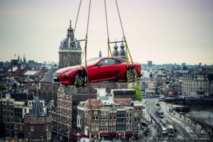 Lexus car hanging high above Amsterdam city centre